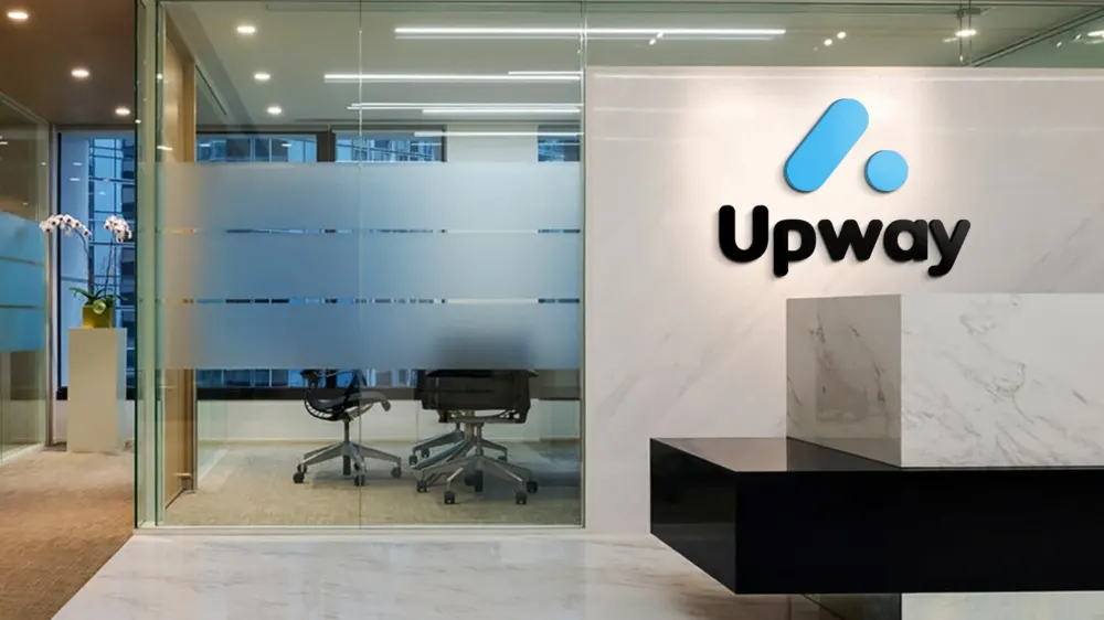 Upway Digital office in Buenos Aires, with the logo on the wall